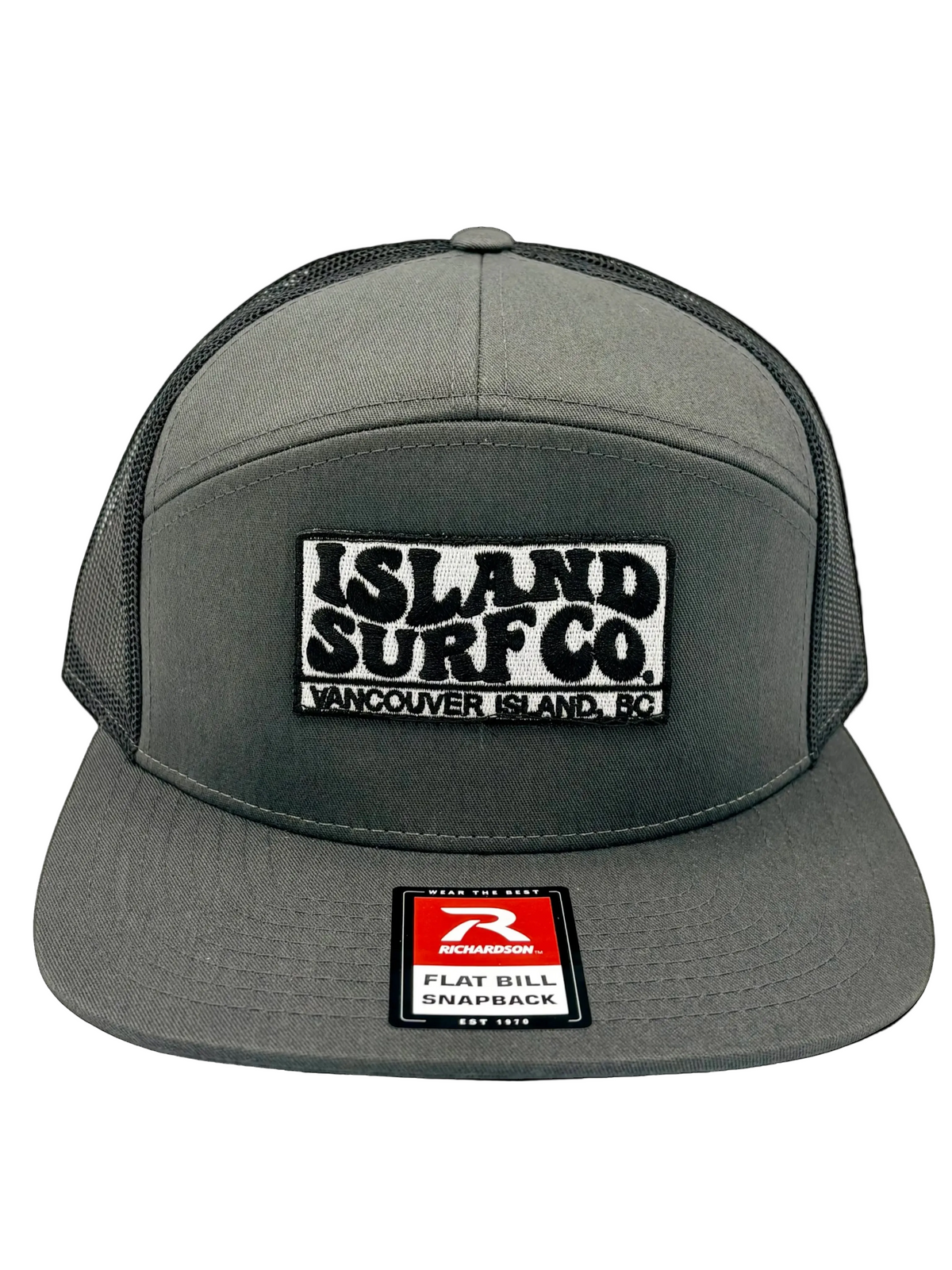 A dark gray 5-panel trucker hat with a black and white embroidered 'ISLAND SURF CO.' patch on the front.