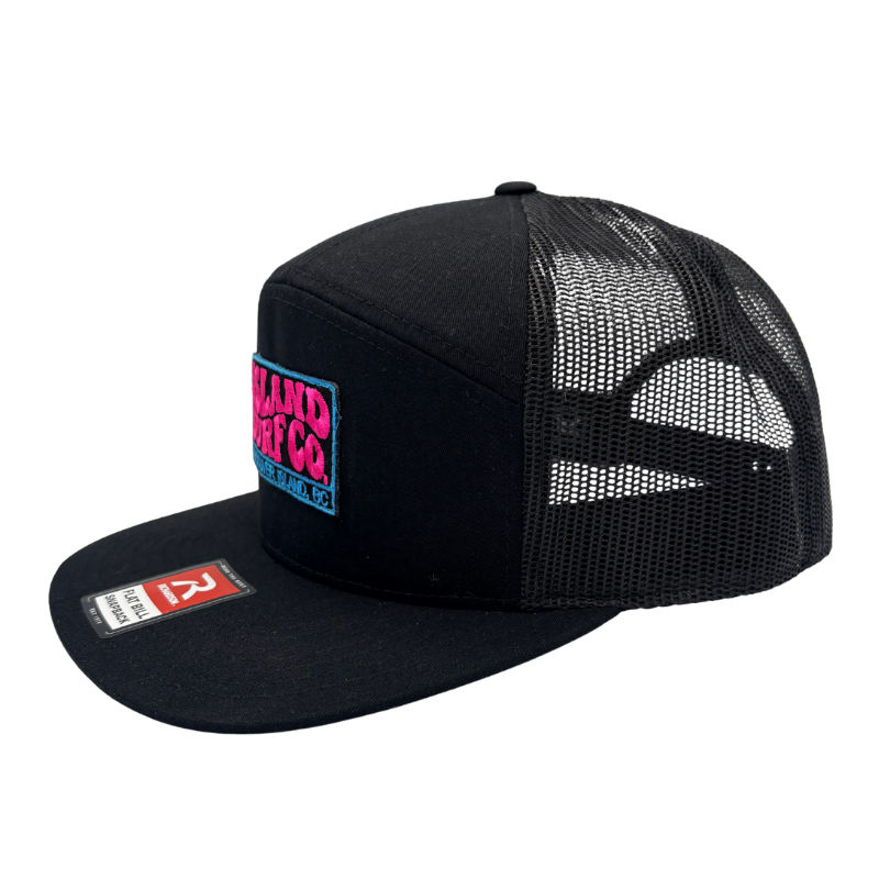 A black trucker hat with a flat brim, black mesh back, and a colorful front patch reading 'Land of the Free' on a white background.