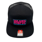 A black trucker hat with a curved brim, featuring a front patch that reads 'ISLAND SURF CO. VANCOUVER, ISLAND, BC' in pink and blue, and a visible flat bill snapback sticker from Rawlings.